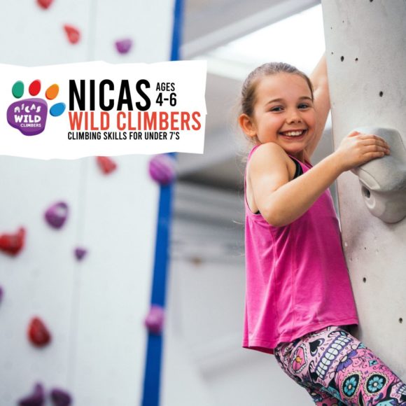 female wild climbers smiling on the wall