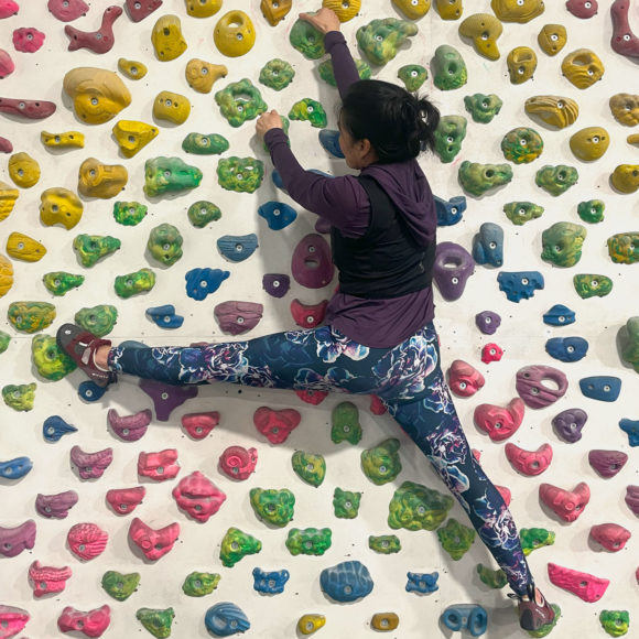 mobility and flexibility on display on a rainbow climbing wall