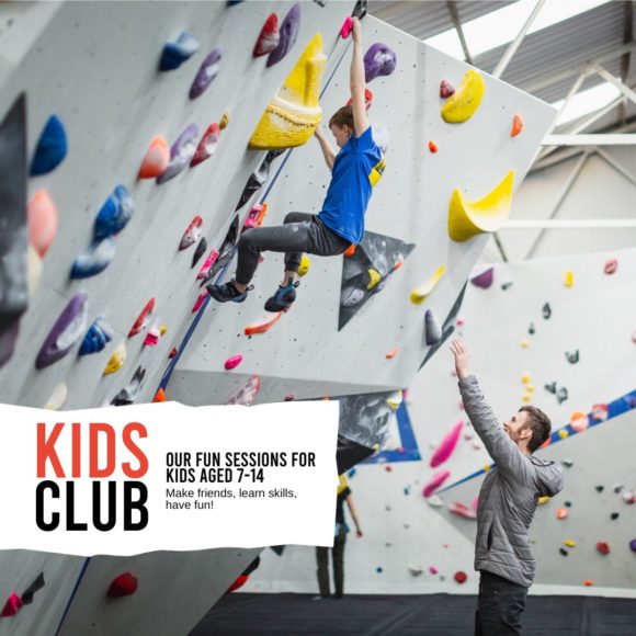 Kids Club climber is watched by a coach as they climb an overhung wall
