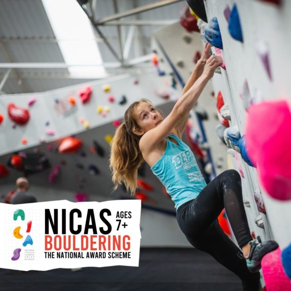 NICAS Bouldering participant climbs an overhung wall
