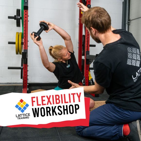 LATTICE TRAINING COACH GUIDES A PARTICIPANT IN STRETCHING OVERHEAD WITH A WEIGHT