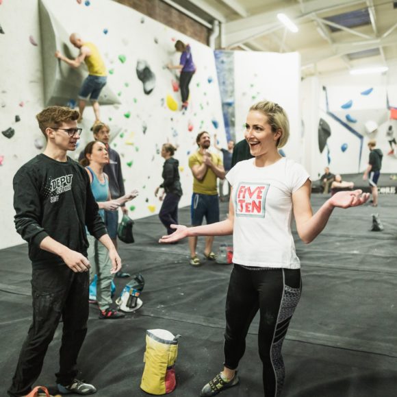 depot climbing male and female members talking on the matts