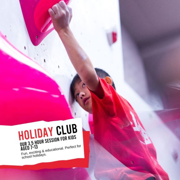 male junior climber reaches for a big pink hold. title image for holiday club at depot sheffield