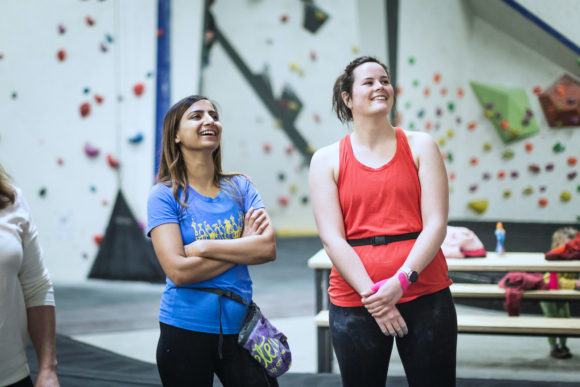 Two women at an indoor bouldering gym