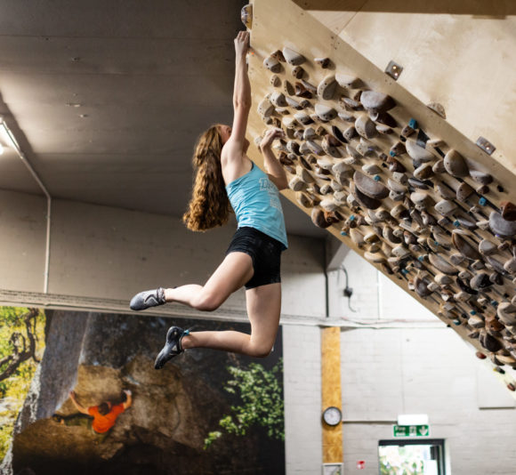 Depot Climbing Academy athlete tops a board problem