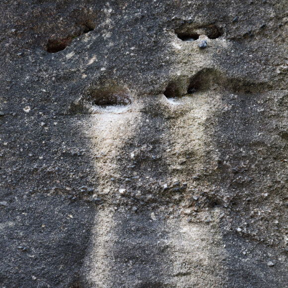 chalk streaks on rock as a result of outdoor bouldering