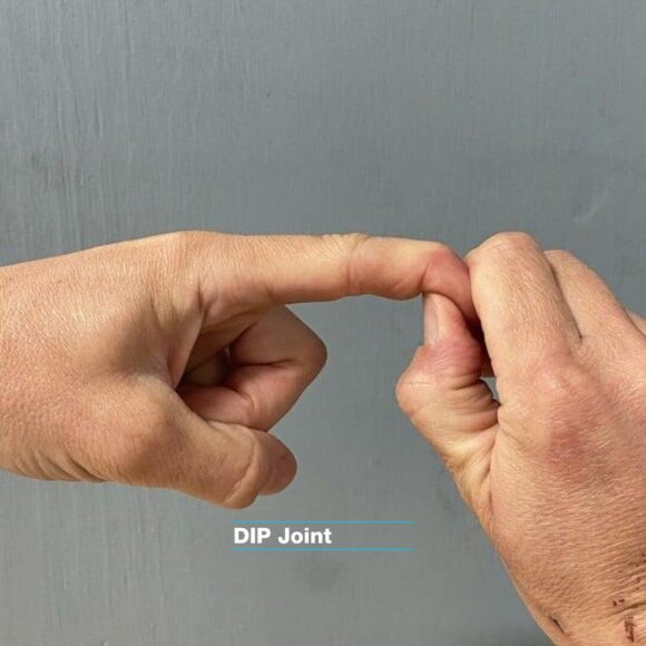 DIP joint climbing physio movement. The right hand is jently stretching the left hand dip joint of the index finger.