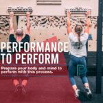 a male and female climber hang from a fingerboard whilepreparing to perform in climbing and provide injury prevention in their climbing.